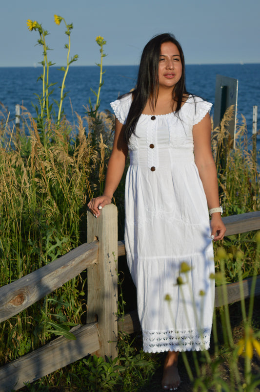 Woman wearing white cotton dresss at chicago lake front. Sunny